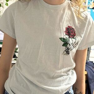 Skeleton hand holding rose tee